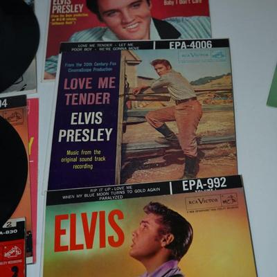 Sale Photo Thumbnail #377: Elvis Presley blue suede shoes,, cardboard sleeve and 45 record. 
Elvis Presley Hound Dog paper sleeve jacket and the 45 record 
Elvis SO Glad Your Mine cardboard sleeve and  =45 record 
two records without the sleeves 45's Thats All right &Elvis Presley 