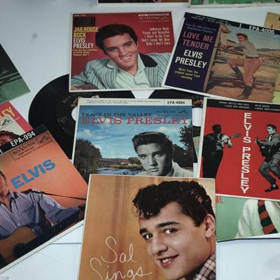 Sale Photo Thumbnail #367: Elvis Presley blue suede shoes,, cardboard sleeve and 45 record. 
Elvis Presley Hound Dog paper sleeve jacket and the 45 record 
Elvis SO Glad Your Mine cardboard sleeve and  =45 record 
two records without the sleeves 45's Thats All right &Elvis Presley 