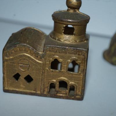 Sale Photo Thumbnail #379: pair of vintage still banks. 
dog 4 1/4" 
the smaller building is 3" 
there is alot of paint loss on the dog . there is a slot behind his head to drop the coins
to get the coins out there is a screw, No coins are in the bank
The building is in good condit