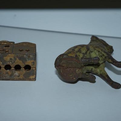 Sale Photo Thumbnail #382: pair of vintage still banks. 
dog 4 1/4" 
the smaller building is 3" 
there is alot of paint loss on the dog . there is a slot behind his head to drop the coins
to get the coins out there is a screw, No coins are in the bank
The building is in good condit