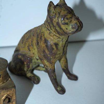 Sale Photo Thumbnail #386: pair of vintage still banks. 
dog 4 1/4" 
the smaller building is 3" 
there is alot of paint loss on the dog . there is a slot behind his head to drop the coins
to get the coins out there is a screw, No coins are in the bank
The building is in good condit
