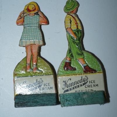 Sale Photo Thumbnail #400: grouping of 11 Kennedy Dairy carboard cut outs of children and advertising of Kennedy Dairy of Madison, WI 
I would guess these are from the 30's . In good condition and good color except for one the face is missing. 
Otherwise these are a perfect project