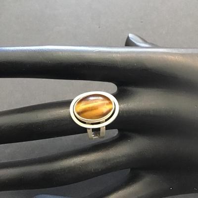 Sale Photo Thumbnail #36: Very nice silver 925 Israel ring with polished tiger eye stone. Please see attached photos.