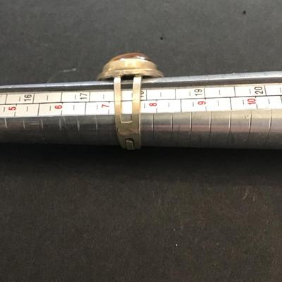 Sale Photo Thumbnail #39: Very nice silver 925 Israel ring with polished tiger eye stone. Please see attached photos.