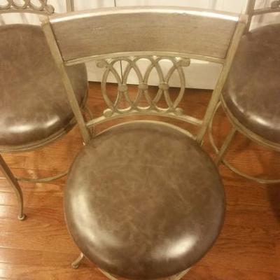 Set of 4 swivel bar stools with faux leather cushions