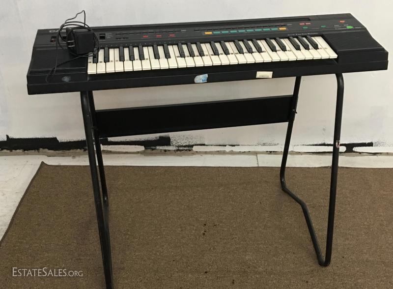 Casio 465 Sound Tone Bank Electric Keyboard w/Stand | EstateSales.org