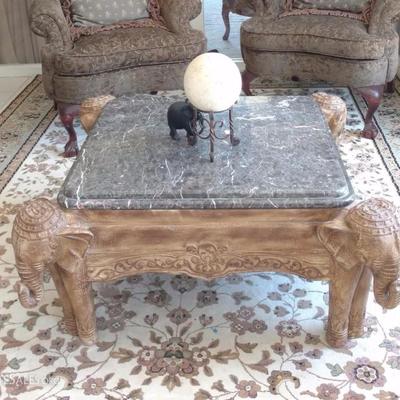 Marble top, carved wood cocktail table
