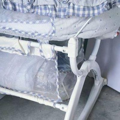 Graco Bassinet (w/ vibrate feature) and Linen basket below + linens thrown in