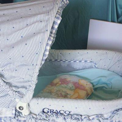 Graco Bassinet (w/ vibrate feature) and Linen basket below + linens thrown in