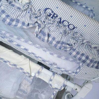 Graco Bassinet (w/ vibrate feature) and Linen basket below + linens thrown in