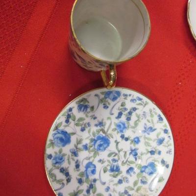 3 decorative tea cups and saucers