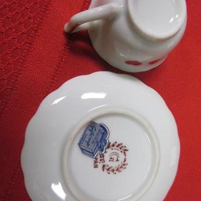 3 decorative tea cups and saucers