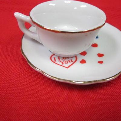 3 decorative tea cups and saucers