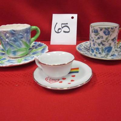 3 decorative tea cups and saucers