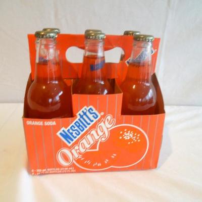 Lot 23 Six Pack of Nesbitt's Orange Soda 10 oz. Pop Bottles in Carton