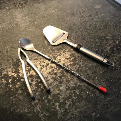Cheese cutter cocktail mix spoon and nut cracker  