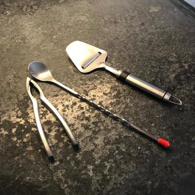 Cheese cutter cocktail mix spoon and nut cracker  