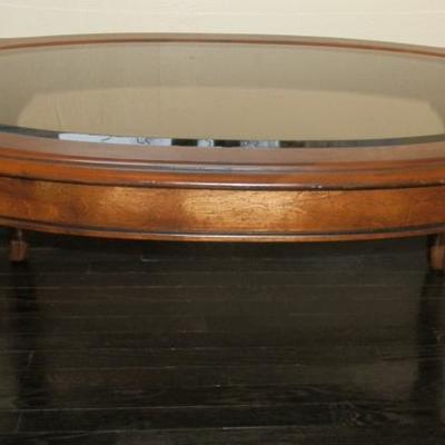 Solid Wood with Oval Smoked Glass Top Coffee table - Lot 115