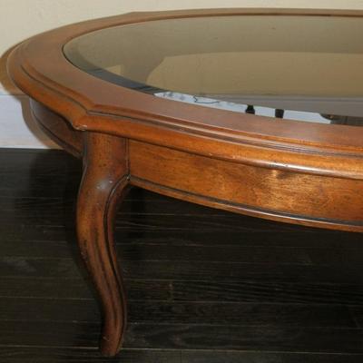 Solid Wood with Oval Smoked Glass Top Coffee table - Lot 115