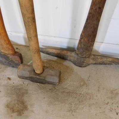 Set of Heavy Head Tools Including Sledge Hammer, Pick, and Ax