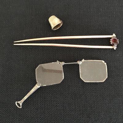 Lot 24 - Hat Pin and Glasses 