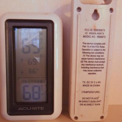 Lot 38: A Pair of Indoor Battery Weather Clocks with Remotes