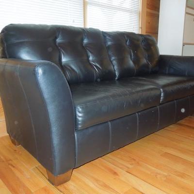 Lot 45: Black Bonded Leather Tufted Couch Ashely Furniture 