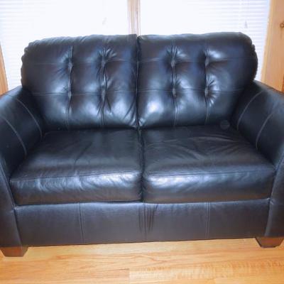 Lot 46: Black Bonded Leather Tufted Loveseat Ashely Furniture 