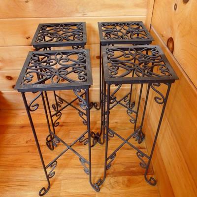 Lot 121: Four Scrolled Collapsable Iron Plant Stands