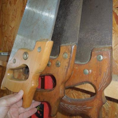 Lot 213: Three Wood Handled Handsaws and a 48" Level