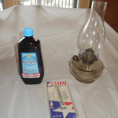 Lot 55: Glass Hurricane Lamp, Oil, Wick and Funnel