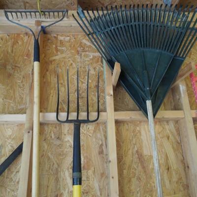 Lot 219: Two Leaf Rakes, a Spreading Rake and a Pitchfork