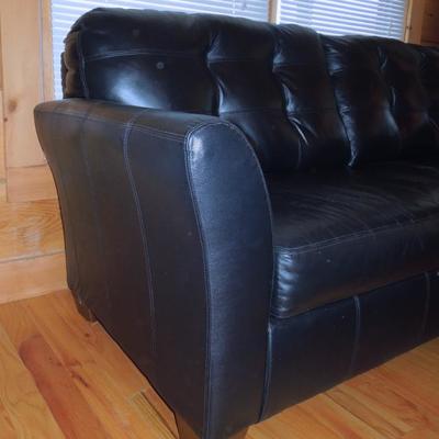 Lot 45: Black Bonded Leather Tufted Couch Ashely Furniture 