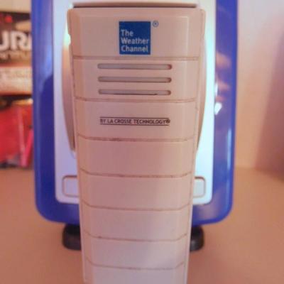 Lot 38: A Pair of Indoor Battery Weather Clocks with Remotes