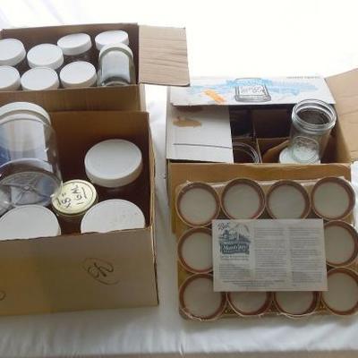 Lot 186: Huge Lot of Glass Storage Jars and Lids