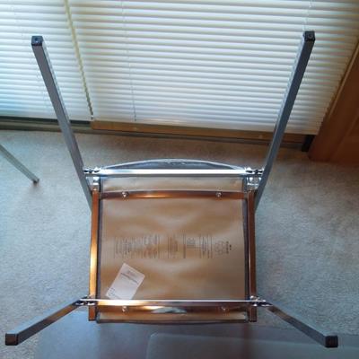 Lot 112: Two Grey Upholstered Metal Frame Stacking Chairs