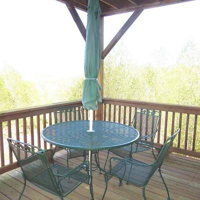 Lot 57: Round Green Metal Mesh Patio Table, 4 Armchairs and Umbrella