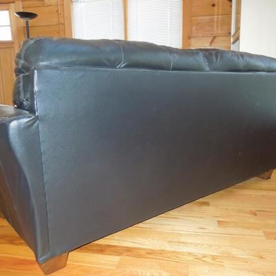 Lot 45: Black Bonded Leather Tufted Couch Ashely Furniture 