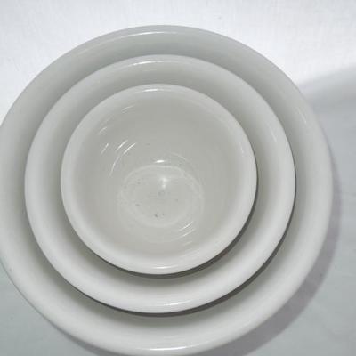 Lot 179: Three Solid White Ceramic Nesting Mixing Bowls