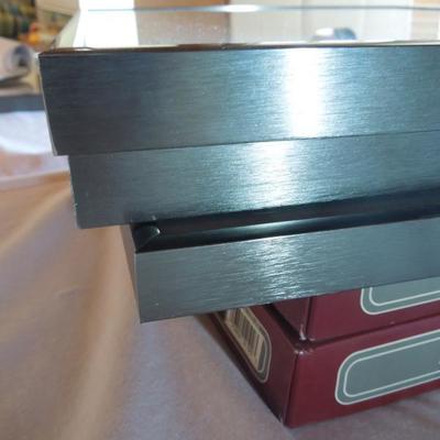 Lot 172: Four Brushed Metal Frames and Two Unused Leather Photo Albums