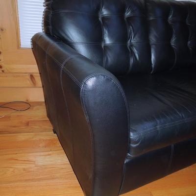Lot 46: Black Bonded Leather Tufted Loveseat Ashely Furniture 