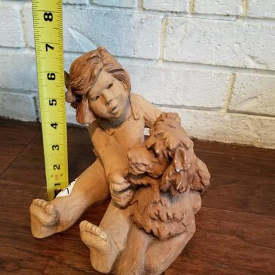 Girl Holding Dog Clay Sculpture 
