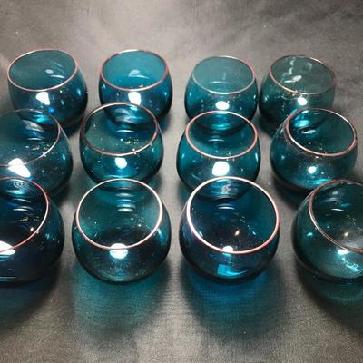 Lot 48- MC Set of Twelve Burmese Handblown Teal Glass Rolly Polly Glasses