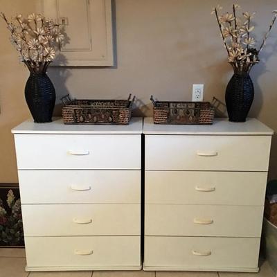 Two white chest of drawers including decor