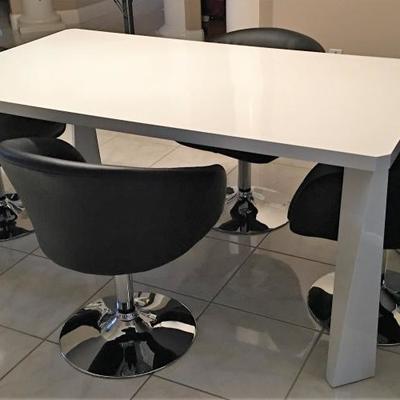Contemporary kitchen table with four swivel chairs