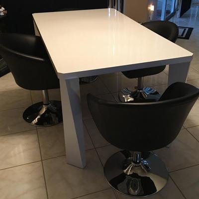 Contemporary kitchen table with four swivel chairs