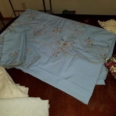 Collection of vintage table clothes and napkin sets