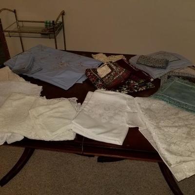Collection of vintage table clothes and napkin sets