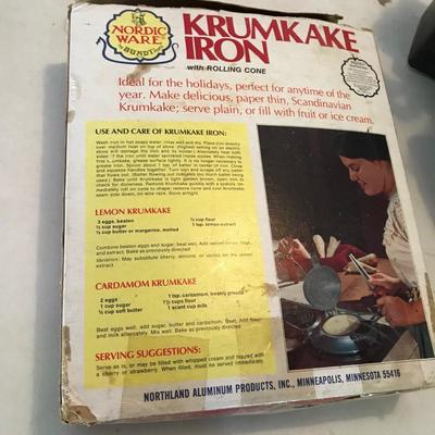 Lot 127 - Vintage Krumkake Iron and New Food Mill