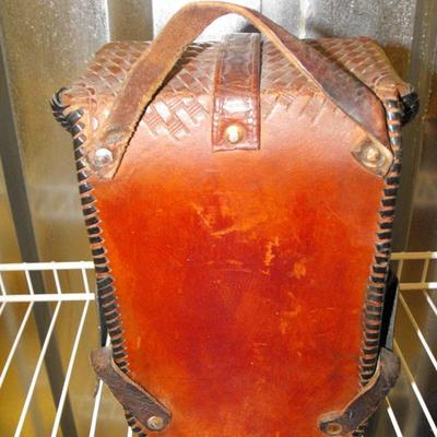 LOT 74  Leather Tooled Saddle Bag and Branding Iron